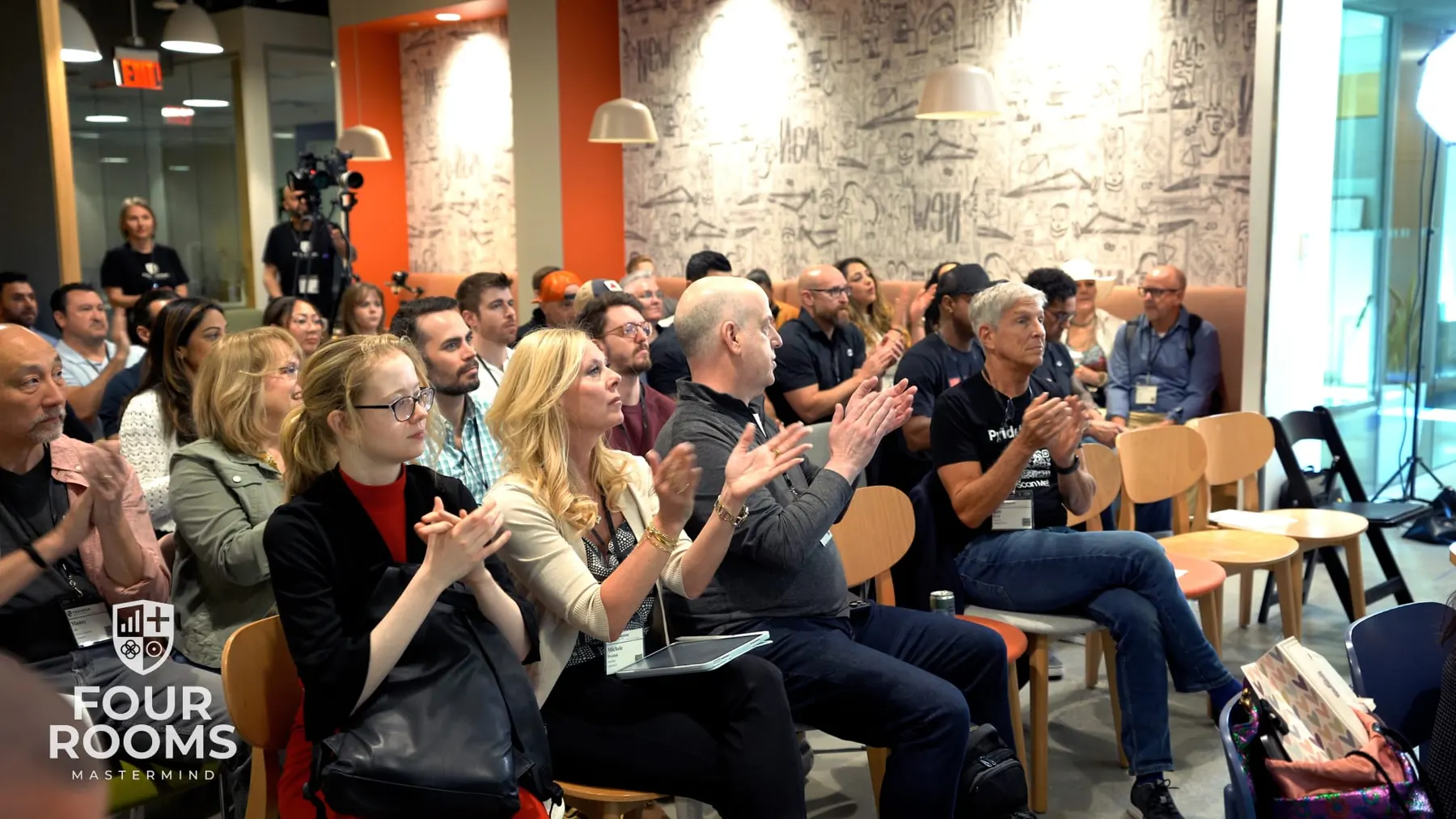 Audience applauding a session