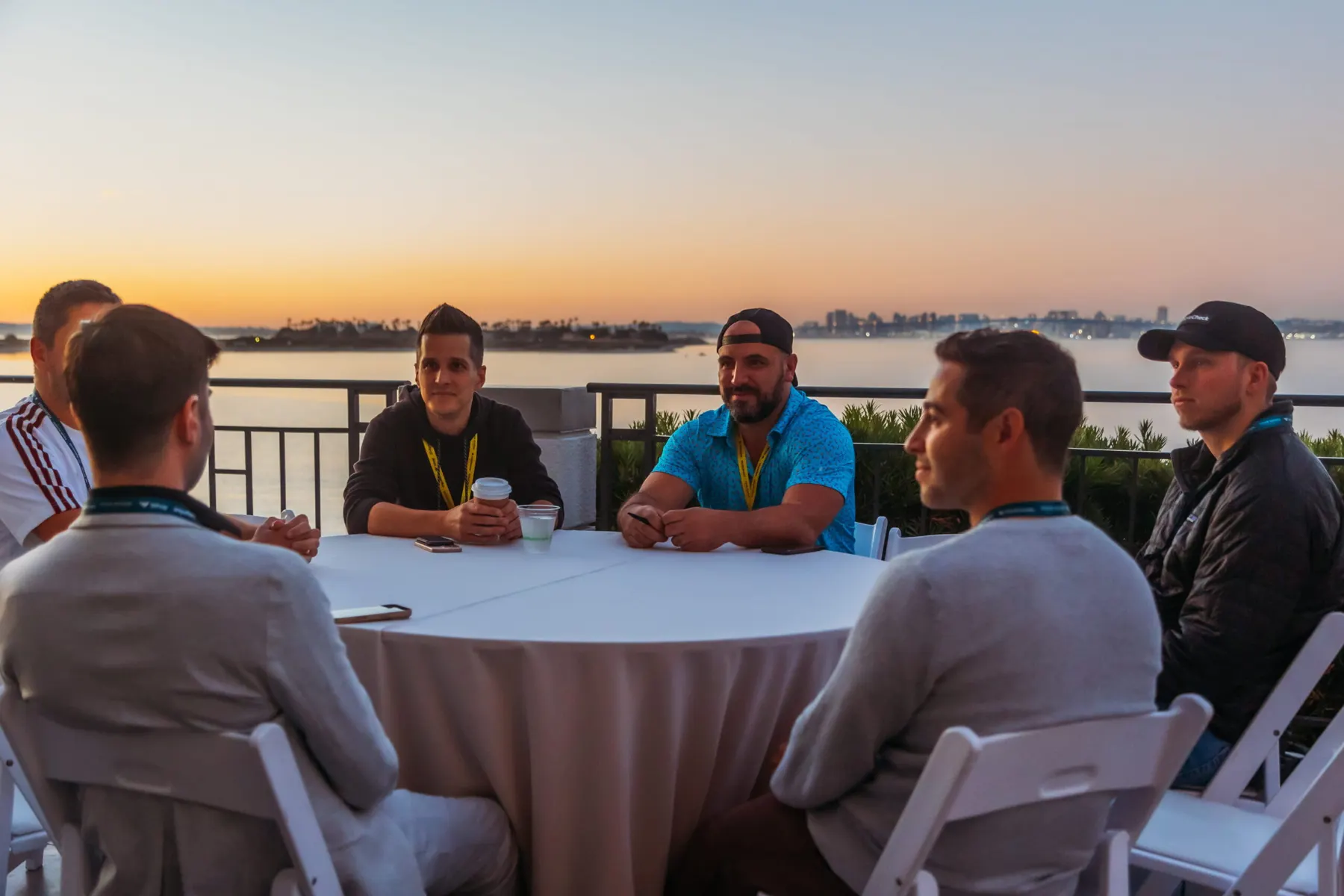 Founders in conversation at a Four Rooms roundtable at sunset